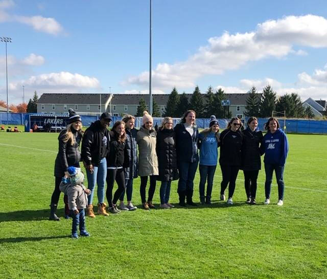A group of GVSU Alumni on a soccer field